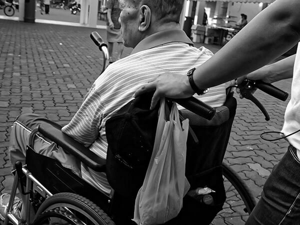 elderly man in a wheelchair